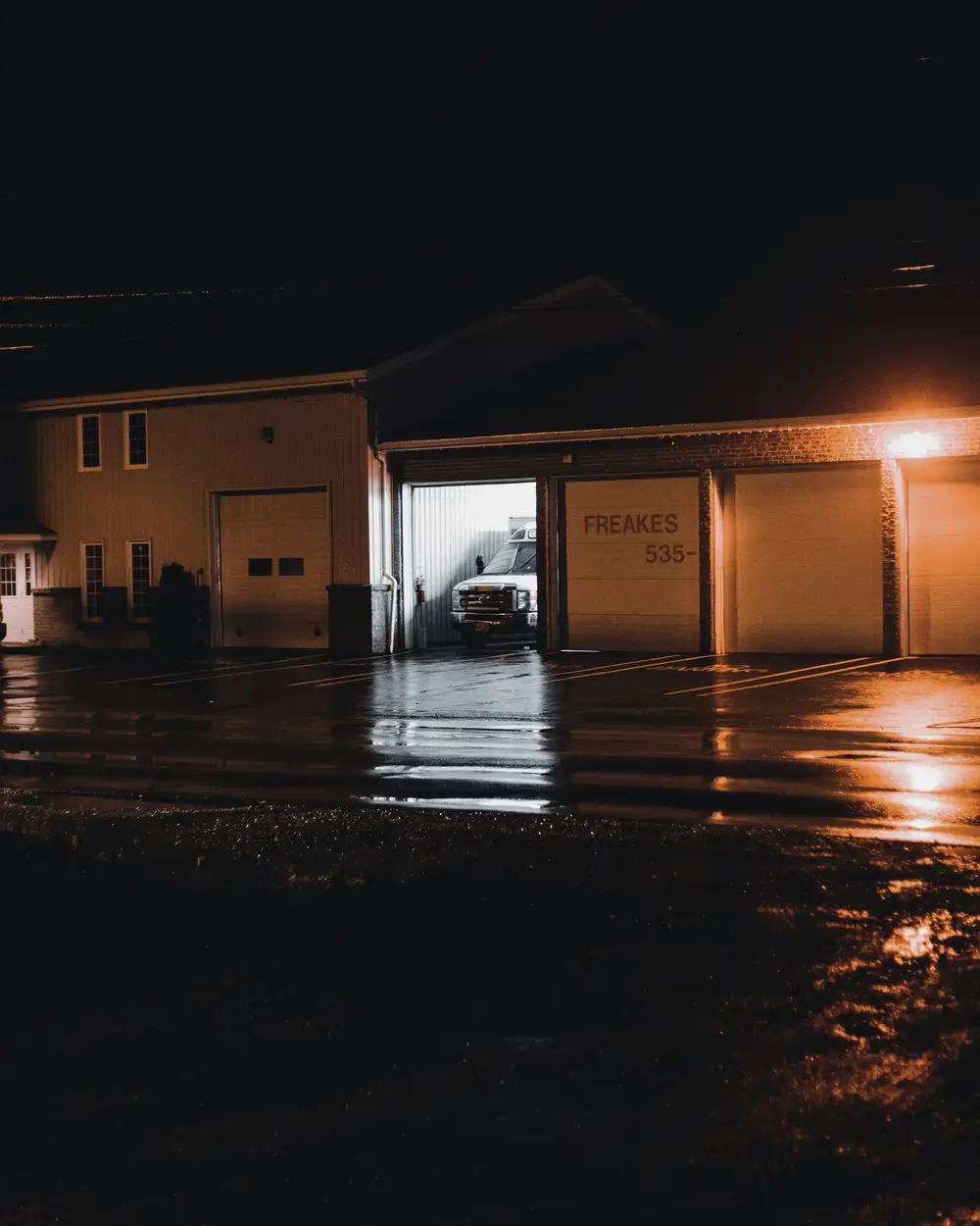 Garage lit up at night after an emergency call